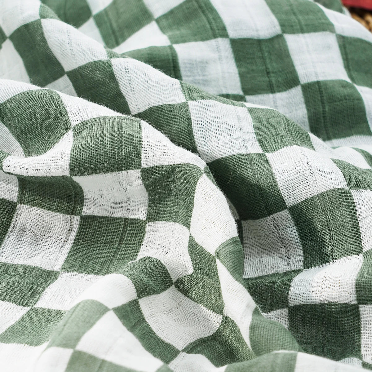 Gros plan sur la mousseline coton bambou du lange bébé