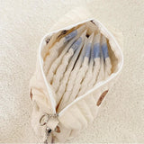 Pochette à langer nomade ouverte avec couches