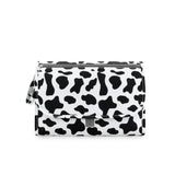 Tapis a langer nomade pliable compacte et impermeable imprime vacje